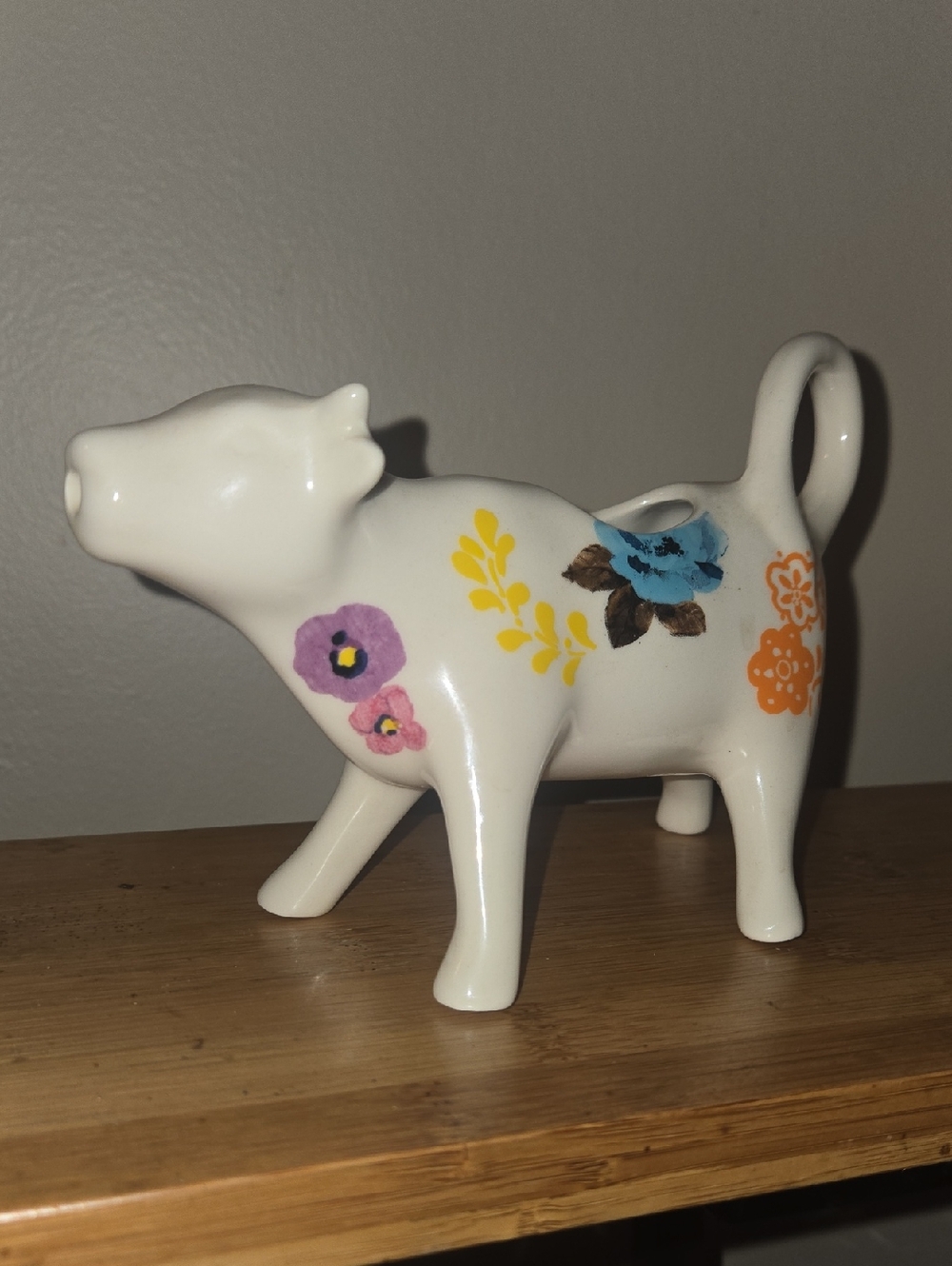 Decorative White Ceramic Cow Creamer with Floral Motif